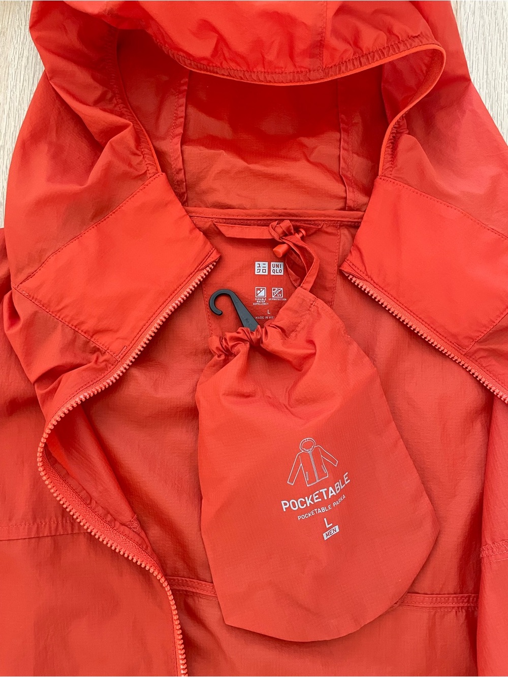 Uniqlo Men’s Orange Packable Windbreaker Jacket